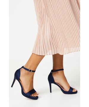 Elegant faux leather heeled sandals with a platform sole
Ankle strap with metallic buckle fastening for a secure fit
Open toe design to elongate the leg
Towering stiletto heel height of 7-9cm
Metallic finish exudes sophistication and glamour

Crafted with meticulous attention to detail, these Talia Platform Heeled Sandals from Coast are the epitome of refined elegance. Designed to make a statement at formal occasions like weddings, races, or graduations, these sandals radiate luxury. Style them with a floor-length gown or a tailored midi dress for a polished and sophisticated look that commands attention. Embrace the allure of these sandals and let them be the centerpiece of your ensemble, elevating your confidence and poise for an unforgettable evening.