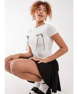 Cute T-shirt alert! Featuring bow detailing, just make your white basic tee a trend again.