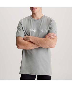 Mens Calvin Klein Lounge T- Shirt in grey.- Round neck.- Short sleeves.- Signature tape inside the neckline.- Logo print.- Regular fit.- Ref: 000NM2264E5JX