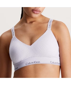 Womens Calvin Klein Lightly Lined Bralette in purple.- Adjustable shoulder straps.- Coverts to cross-back style.- Hook fastening at the back.- Padded for subtle lift effect.- Calvin Klein signature elastic underband.- Ref: 000QF7797ELL0