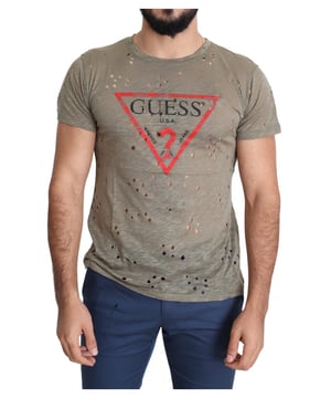 Hermosa camiseta de algodón elástico marrón de Guess, completamente nueva.  
Cuello redondo y mangas cortas.  
Color: Marrón  
Material: 95% Algodón 5% Elastano  
Talla: Ajuste Regular  
Detalles del logo  
Fabricado en Italia