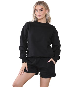 Introducing the Kruze Womens Tracksuit Set: a stylish and comfortable tracksuit set for women. The regular fit crew neck sweatshirt features ribbed waist and cuffs, while the soft fleece lining adds an extra layer of comfort. The accompanying shorts also feature a regular fit and an elasticated waistband with an adjustable drawstring for the perfect fit. Elevate your activewear game with this must-have set!