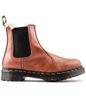 Women's Tan Dr. Martens 2976 Chelsea Boots, With A Leather Upper, Featuring An Elasticated Gusset And The Signature Airwair Heel Loop. These Ladies' Boots Have A Soft, Overspilling Faux Fur Lining, The Unmistakable Doc's Dna Like The Iconic Yellow Stitching, Airwair Branding And The Goodyear Welted Air-cushioned Sole With Rugged Tread.