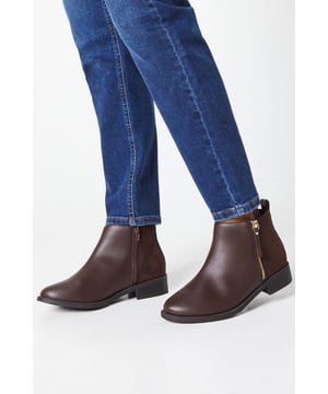 Extra wide fit for enhanced comfort
        Side zip closure for easy on and off
        Ankle-length design for versatile styling
        Flat heel (0-2cm) for all-day wearability
        Faux leather upper for a sleek appearance
    
    Step out in style and comfort with these versatile Myla ankle boots. Perfect for the woman who values both fashion and functionality, these boots offer an extra wide fit to accommodate various foot shapes. The side zip feature ensures effortless wear, while the flat heel provides stability for extended periods of use. Ideal for transitioning from day to night, these boots can be dressed up or down with ease. Pair them with tailored trousers and a crisp blouse for a polished office look, or team them with a flowy midi dress for a chic brunch ensemble. The ankle-length design makes these boots a year-round staple, easily worn with tights in cooler months or bare legs when the weather warms up. Whether you're heading to a baby shower or meeting friends for dinner, these Dorothy Perkins boots will keep you looking stylish and feeling comfortable throughout your day.