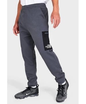 Size & Fit Standard fit is athletic and relaxed Product Features Soft and warm fleece fabric Elastic waist for a personalized fit Ribbed ankle cuffs Side pockets and cargo pocket with zip closure TNF Half Dome logo on cargo pocket Machine wash The North Face Fleece Cargo Pants are imported. - - . Stave off cold, wintry weather for unbothered comfort with the Men's The North Face Fleece Cargo Pants. - - .  These fleece joggers supply the cozy warmth you expect from The North Face with a clean, smooth aesthetic that goes above and beyond the basics.