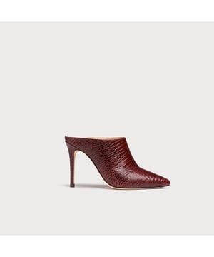 Our Hannah mules are a sharp and sexy style that offer an autumnal twist on a summer classic. Crafted in Spain from burgundy lizard-effect leather, this contemporary, backless style has a pointed toe, a straight cut and a 100mm stiletto heel. Wear Hannah with skirts, dresses and tailoring from now all the way through to autumn.