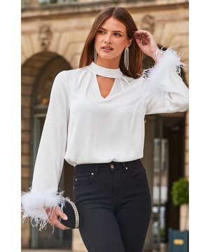 For when you want to feel fabulous
Embellished buttons, because you deserve to shine
Keyhole cut out, it’s all in the detail
Removable feather trims for maximum impact
Create a chic tonal look with white tailored trousers
Add edge with leather trousers