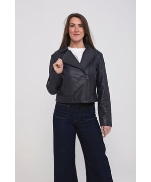 The Elle leather jacket is the epitome of style and sophistication. Made from genuine leather, this jacket is not only durable but also timeless in design. So, whether you're going for a more casual or dressier look, this piece adds the perfect edgy yet chic touch and is the perfect addition to finish off any outfit. Model wears size 10. Shell 100% leather. Lining 100% polyester. Dry clean only.