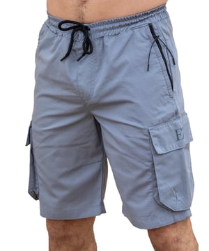 Expertly designed with top-quality ripstop fabric, these Enzo technical cargo shorts offer unparalleled durability. The convenient cargo pockets and zip side pockets make for easy storage, and the elasticated waistband with an adjustable drawstring ensures a comfortable fit. Upgrade your wardrobe and gear with this must-have for any outdoor enthusiast.