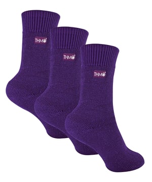 Keeping your little ones warm, comfortable and protected when they're outside is important. That's why we've designed THMO Kids Thermal Socks. The perfect 3 pair value pack to keep your Children’s feet nice and cosy all winter! These socks have a stretchy comfort top that moulds to their leg to reduce constriction rings and tightness, which allows for regular circulation. As well as all day comfort, these socks feature a cushioned foot bed providing feet with an extra layer of support. These socks come in 3 pair value pack so they’ll keep your kids feet warmer for longer and make them great value for money when stocking up your kids sock drawer! They have been double brushed on the inside to maximise warmth by trapping warm air and keeping it close to their feet and legs. The ribbed welt at the top of the sock has been designed to rest to the natural contours of their legs. This wide soft top provides all day comfort and will reduce the chances of nasty constriction rings developing around their legs. These Children’s Thermal Socks come in 4 colour options: Black, Navy, Fuchsia, Purple. They also come in 3 kids size options: 9-12 UK, 12-3 UK and 4-5.5 UK, The THMO badge is also heat transferred onto the side of the socks. These socks come in a 3 pack and are made from 93% Acrylic, 6% Polyamide, 1% Elastane. They’re available in 3 Children’s sizes 9-12 UK(27-30 EUR 10-1 US), 12-3 UK (30-36 EUR, 13-4 US) and 4-5.5 UK(37-38.5 EUR, 5-6.5 US). They are machine washable at 40.