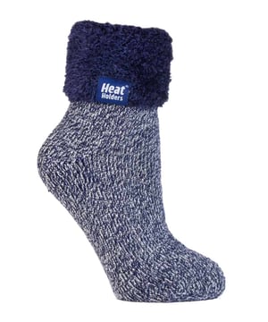 Lounge around the home in these cosy socks. Whether you're looking to stay warm or comfortable indoors, these lounge socks feature a cute and stylish design so you can pair them with any casual outfit! Every Heat Holders® sock, including these lounge socks, are created by UK PATENTED knitting technology. This unique manufacturing process together with Heat Holders® innovative Japanese designed thermal yarn ensures maximum warmth is held close to the skin, keeping your feet warmer for longer. With a strong TOG rating of 2.34, these socks are designed to keep your feet warm as well as retain heat close to the skin. They also prevent your feet from feeling clammy with their soft brushed inner thermal lining. With long pile cushioning, these thermal socks will help keep feet fully comfortable and supported. Heat Holders are made from a specially developed heavy bulk yarn which has extreme thermal-like qualities. These socks would make the perfect gift for any woman who suffers cold feet! Choose from our different colours and styles to suit your woman's fashionable needs! Why not treat yourself to these lovely pair of cosy socks to wear in bed? Featuring a turn over cuff, you can pull up or roll down these socks for a much more comfortable fit! These socks also have a low cut ankle length so you can subtly show off your socks! Stop sliding or slipping on wooden or tiled floors with these non-slip gripped socks. They feature a rubber-like non-slip grip so you can walk around the home comfortably. These socks are available in womens sizes 4-8 UK