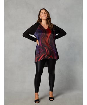 Details

Designed for women 5'3" and under
Jersey long sleeves
Woven layered pleat detail back
High low hemline
V-Neckline

Garment Care

Composition: Main - 100% Polyester, Back - 100% Polyester, Sleeves - 95% Viscose 5% Elastane
Machine washable  

Sizing

Length from back neck to hem: 83cm

In classic black, this tunic has a silky satin front with a stylish swirl print, and full-length jersey sleeves for comfort. The back is cut from a pleated, draping chiffon, with two layers for that all-important coverage. It has a lengthening V-neck, as well as a high-low hemline which creates a flattering silhouette. Dress this top up or down, depending on your plans.