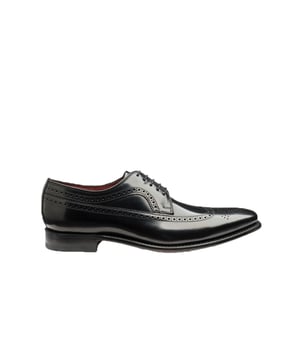 Loake Clint Formal Shoe Black
No English gentleman’s wardrobe is complete without a pair of handcrafted Goodyear welted brogues.This stylish wing brogue derby shoe, made using the ‘Ridge’ last shape is an essential for formal occasions that comes in black polished leather.

Leather
Made in India
Ridge Last Shape
Brogue detailing