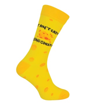 For anyone who loves Cheese and a good pair of novelty socks, these socks are perfect for you! With bright funky colours and a funny phrase on the side saying “It Ain’t Easy Being Cheesy”, these socks are the best addition to your sock drawer. The packaging is a genius gift box shaped and designed like a slice of Cheese and is the perfect gift for any Cheese lover! Even if you’re looking for an extra Christmas gift, Birthday present or even a stocking filler, these socks would be ideal. With Cotton Rich fibres you can be sure that these socks are super soft and comfortable on your feet as well standing out from the crowd with it’s bright funky colours and fun design which will grab the attention of anyone. All of the Urban Eccentric products are produced for comfort and quality. They aim to reduce our impact on the environment as much as they possibly can, that's why Urban Eccentric are constantly redeveloping our processes and packaging to get as much recycled as possible. These brand of socks value humour, original designs, having fun and high quality production! These socks are available in Yellow and come in Men’s One Size 6-11 UK. They’re made from 75% Cotton, 24% Polyamide, 1% Elastane and are Machine Washable.