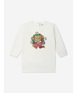 Moschino depict high quality construction in their eccentric designs. This baby girls cloud dress captures the Italian label's superior craftsmanship and fun outlook. Made with 'Moschino' teddy bear holiday print on the front with ribbed trims. She will look and feel divine. ‚ Moschino Teddy Bear Holiday Print ‚ Round Neck‚ Long Sleeves‚ Press-Stud Fastening At the Back‚ Fabric: 95% Cotton, 5% Elastane‚ Hand-WashingMoschino : Baby Height1-3M: 21" / 54cm3-6M: 23.6" / 60cm6-9M: 26.3" / 67cm9-12M: 29.1" / 74cm12-18M: 31.5" / 80cm18-24M: 33.8" / 86cm2Y: 36.2" / 92cm3Y: 38.6" / 98cm