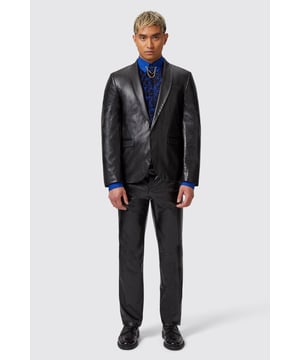 The Trinity faux leather snakeskin suit is something you've never seen before in the world of tailoring. A modern Innovative design meets classic tailoring with this number. The jacket features a single button closure with a shawl lapel, jet pockets and a metered cuff with 5 buttons. The first button features a skull with a lime buttonhole, it's all about the details. This sophisticated slim fit silhouette is made for sharp dressing with an added edge. Complete the full look with the matching Trinity trousers and a vibrant crisp shirt underneath for your next special event.