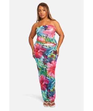 Vibrant tropical print mesh two-piece set
        Strapless bandeau-style crop top
        High-waisted maxi skirt with figure-hugging silhouette
        Lightweight and breathable fabric ideal for warm weather
        Versatile design suitable for beach or resort wear
    
    Make a splash at your next beach getaway with this eye-catching tropical maxi two-piece set. The strapless bandeau top pairs perfectly with the high-waisted maxi skirt, creating a flattering silhouette that's both comfortable and stylish. The lightweight mesh fabric ensures you'll stay cool even on the hottest days, while the bold floral print adds a touch of exotic flair to your holiday wardrobe. Style it with strappy sandals and oversized sunglasses for a day by the pool, or dress it up with wedges and statement earrings for beachside cocktails. This versatile set is a must-have for any sun-soaked adventure, allowing you to transition effortlessly from lounging on the sand to sipping sundowners at the resort bar.
