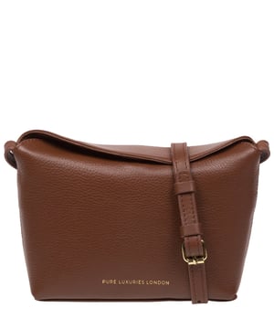 The 'Lolo' cross body bag from the Pure Luxuries Marylebone collection is handcrafted from high-quality, genuine Nappa leather with a natural super-soft touch. The bag is secured by a magnetic closure which opens to reveal a 100% cotton-lined interior and includes two slip pockets. Features gold-coloured metal fittings alongside the adjustable slim leather strap, with a maximum drop length of 65cm. The Pure Luxuries logo is embossed in gold foil for a beautifully simple finishing touch.