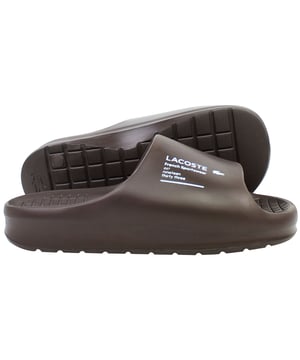 The Lacoste Serve Slide 2.0 223 2 CMA Men's BrownÂ Sliders deliver timeless style and exceptional comfort, making them a versatile option for casual wear, poolside lounging, or beach outings. These sliders feature a sleek design with iconic branding for a polished yet relaxed look.
Â 
Key Features:
Ergonomic Footbed: 

Contoured for superior comfort and support, ideal for extended wear.


Durable Synthetic Strap: 

Embossed with the signature Lacoste crocodile logo, adding a stylish and recognizable touch.


Slip-On Design: 

Easy to wear, offering convenience for relaxed occasions or quick outings.


Textured Rubber Outsole: 

Ensures reliable grip and traction on both wet and dry surfaces.


Lightweight Construction: 

Reduces fatigue, making them perfect for all-day comfort.


Water-Resistant Materials:

Designed to handle pool, beach, or shower environments without compromising durability.


Classic BrownÂ Colorway:Â 

A versatile and timeless design that pairs effortlessly with casual or sporty outfits.


Â 
The Lacoste Serve Slide 2.0 223 2 CMA Men's BrownÂ Sliders are a must-have for laid-back footwear, offering a combination of comfort, durability, and understated style for any relaxed occasion.
Â 
Â 
Â 
