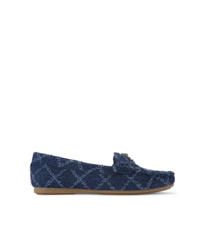 The Kurt Geiger Greenwich Moccasin slip-on loafer features a blue denim upper with frayed diamond quilting design. There is antiqued brass branding on the front alongside micro eagle head.