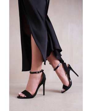 Step out in style and sophistication with our High Heels with Threaded Wide Straps. These stunning heels are designed to elevate your outfit and add a touch of glamour to every step.
Key Features:


Threaded Wide Straps: The unique threaded wide strap design adds an elegant and polished touch to these heels, making them the perfect option for those who want to make a fashion statement.

Breathable Design: The open toe front and heel provide breathability, ensuring your feet stay cool and comfortable even on warmer days.

Comfortable Height: The high heel provides stability and support, while the cushioned insole ensures all-day comfort. Walk confidently knowing that your feet will stay comfortable, no matter where the day takes you.

Versatile Style: These heels are versatile and can be paired with a variety of outfits. Dress them up with a skirt or dress for a night out on the town, or dress them down with jeans for a more casual look. The options are endless.

Specifications:


Material: Faux Leather

Strap Detail: Threaded wide straps add a unique and stylish element

Closure: Buckle closure for a secure and adjustable fit

Sizes: Multiple sizes available

Colours: Available in various options

Elevate your style and make a statement with our High Heels with Threaded Wide Straps. Combining fashion and functionality, these heels allow you to showcase your individuality while enjoying all-day comfort. Step out with confidence and embrace your inner trendsetter.
Where's That From crafts footwear with care, focusing on unique designs that offer the latest trends, luxury comfort, and unparalleled quality. Follow our social media accounts for daily inspiration on putting together outstanding looks.