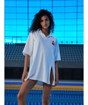 A trending style of the season, this polo dress is elevated by the dramatic split thigh detail and signature shark print to the chest. Slightly oversized, it’s perfect to throw on when heading to the bar.