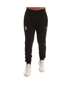 Mens adidas Bayern Munich Essentials Track Pants in black.- Elastic waist with drawcord.- Side seam zip pockets.- FC Bayern embroidered crest.- Ribbed cuffs.- Slim fit.- Main Material: 70% Cotton  30% Polyester (Recycled). Rib Part: 95% Cotton  5% Elastane.- Ref: IC5097