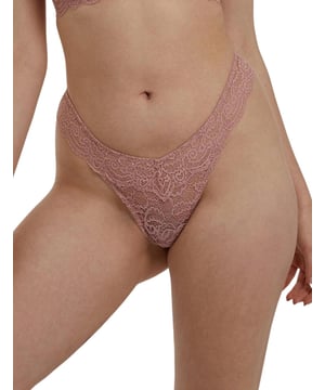 The Ariana range by Playful Promises brings this flirty thong that is perfect for adding a cute feeling to your daily life. Covered in semi-sheer lace it lays softly against your body. It has an extremely flattering shape with a high-cut leg that creates the illusion of longer legs whilst the mid-rise waist and minimal rear coverage showcase your incredible figure.  Flirty thong, Semi-sheer feminine lace, High-cut leg, Mid-rise waist and minimal rear coverage, Elasticated waistband, Comfortable fit, Country of origin: China, Composition: Main: 89% Polyamide | 11% Elastane, Composition: Gusset Liner: 100% Cotton, Listed in UK sizes.   Thong