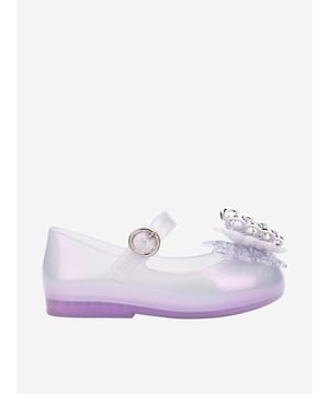 Introduce a touch of enchantment to your little girl's wardrobe with the Girls Sweet Love Fly II Shoes in Purple from mini melissa. Exquisitely designed for the AW2024 season, these shoes blend luxury and playfulness, perfect for any stylish ensemble. Key features include:‚ Vibrant Purple Hue: Captures the eye and enchants with a rich, playful colour.  ‚ Signature Sweet Scent: Keeps the shoes smelling delightful day after day.  ‚ Eco-friendly Material: Crafted from 100% recyclable PVC for sustainability and durability.  ‚ Cushioned Footbed: Ensures comfort during playtime and outings.  revitalise her look with these charming footwear essentials by mini melissa! Order now for a stylish, comfortable season.