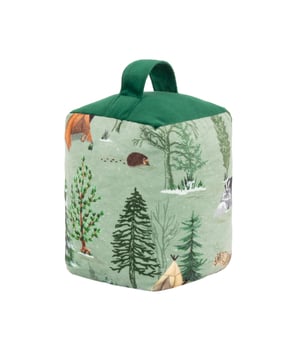 Inspired by woodland walks in winter. Natural, soft greens are found in our forests. The Lodge Wood doorstop features a cosy campfire and woodland animal scene. Complete with a complementing velvet base and storage handle, it is filled with polyester and sand for added weight. Size: 12cm x 12cm x 18cm.