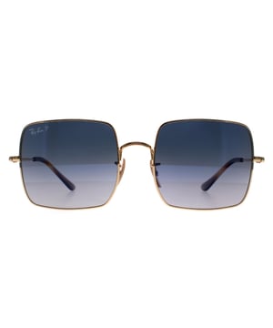 Las gafas de sol polarizadas Ray-Ban Square RB1971 914778 oro pulido azul gris degradado tienen una forma cuadrada de gran tamaño con montura metálica. Un estilo muy diferente para Ray-Ban. Está totalmente de moda porque la forma geométrica es muy popular en este momento. Las patillas y el puente súper finos contrastan con las grandes lentes. Las patillas de plástico y las plaquetas nasales de silicona ajustables garantizan un ajuste personalizado para una mayor comodidad durante todo el día.
