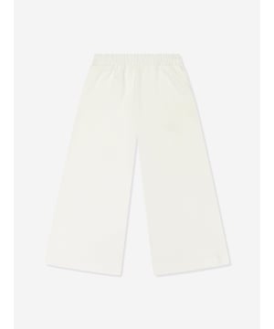 Mama Luma incorporate beautiful eco-friendly materials into their sophisticated handmade constructions. These girls ecru joggers are reflective of the Californian label's precision of beauty. They showcase an elasticated waistband and side pockets for a sleek, effortlessly stylish look. ‚ Handmade‚ 50% Viscose ‚ 45% Polyester ‚ 5% Elastane