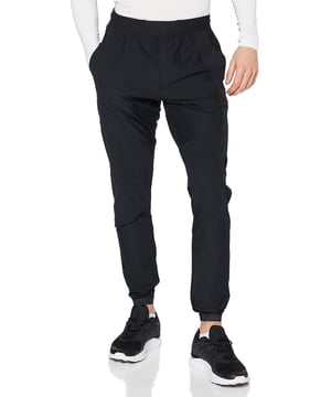 From the streets to the workout, rep these men's Vanish Track Pants from Under Armour. - - . These track pants are cut from smooth, durable poly fabric for lasting wear. - -. Comes In a Black and Grey colourway, they feature an elasticated waistband, with woven ankle cuffs to secure the fit. - -. Finished up with Under Armour branding around the cuffs, and a signature logo at the thigh. Machine washable. - -. Our model is 6'0" and wears medium size.
