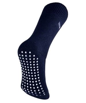 THMO thermal slipper socks have been made with a heavy bulk acrylic yarn with extreme thermal qualities. They have been double brushed on the inside to maximise warmth by trapping warm air and keeping it close to your feet. This brushing also softens the inside of the sock making it a great choice for indoor relaxing. These thermal socks also feel like they are seamless with a neat hand-linked toe. The ribbed welt at the top of the sock has been designed to rest to the natural contours of your legs. This wide soft top provides all day comfort and will reduce the chances of nasty constriction rings developing around your legs. The THMO badge is also heat transferred onto the side of the sock. This is the THMO slipper version for the thermal socks. An anti slip grip has been designed onto the foot of the sock in order to prevent you from slipping on surfaces such as hard wooden floors or kitchen tiles. It is a simple but effective dotted design on the foot of the sock. This is very handy if you are using our thermal socks to lounge around the house instead of going outdoors and using them for walking and hiking. These men's THMO thermal slipper socks are available in 2 colours including black and navy, the grip is a white dotted design. They are a size 6-11 UK 39-45 Eur 7-12 US and they are made from 93% Acrylic, 6% Polyamide, 1% Elastane. They are also safely machine washable.