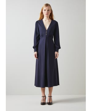 Jersey dresses always feature in our collections, and for good reason; they're reliably chic and comfortable. Our new Jenny dress sits in our LKB Conscious collection thanks to its planet-friendly fabric, a super-soft and stretchy LENZING™ ECOVERO™ viscose* blend in navy blue. It has a V-neck with gold dome button detail, long sleeves with buttoned cuffs and a fit and flare midi-skirt with a centre pleat. Style it with a great pair of heels and take her out for the day.