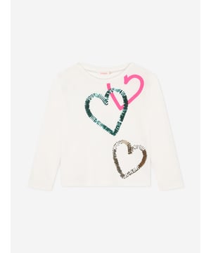 Billieblush deliver a fun enigmatic attitude to their stylish abstracts. This girls long sleeve ivory t-shirt is manufactured in a beautiful cotton jersey design. It features a printed pink love heart and green and gold, sequin love hearts for a touch of sensibility and innovation.  ‚ Ribbed Crew Neckline‚ Long Sleeves‚ Regular Fit‚ 100% Cotton