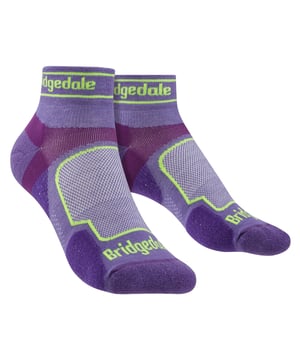 Bridgedale - Ladies Low Cut Ultralight Coolmax Sport SocksA vegan friendly, non-wool sock in Women's specific fit for serious runners who like to explore the world's landscape at a faster pace. These low cut socks deliver fantastic comfort for running whether on or off the trails.The Sport Fit gives supportive compression for stability and balance around the ankle and mid foot and the zero debris cuff gives an extended close fit to prevent debris getting in and this means your sock won’t slip down or bunch in your footwear. The Trail Run Ultralight Coolmax Sport has T2 targeted micro cushioning combined with extra ventilation for the perfect balance of protection and comfort on the toughest terrain. Coolmax Sport Fusion Technology provides resilient padding, moisture wicking, odour control and outstanding durability on the trails. The natural toe box is wide and unrestrictive, allowing your toes to splay when running and the reinforced seam prevents splits and blow outs when descending. Built on a structure of LYCRA® and set by our ThermoFit process ensuring the sock returns to its original shape and size after every wash. These socks are made from 60% Nylon / Polyamide, 37% Polyester / COOLMAX®, 3% Lycra® / Elastane and come in 3 different colours: Pink, Purple & Blue. They come in 3 sizes: Small (3-4.5 UK), Medium (5-6.5 UK), Large (7-8.5 UK) and are Machine Washable.Extra Product DetailsBridgedale Women’s Sport SocksCoolmax FibresOverfoot VentilationFlat Toe SeamsGreat For RunningLow Cut Trainer LengthMoisture WickingVegan FriendlyZero Debris CuffT2 AntiShock CushioningNatural Toe SpreadAntiShock Cushioning3 Sizes AvailableMachine Washable