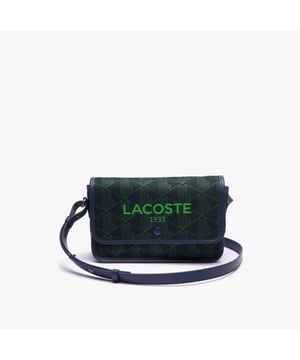 Heritage Monogram Jacquard Flap Schoudertas Afmetingen: L7 x H5.2 x D2.8 inch - L18 x H13.5 x D7 cm Katoenen buitenkant Verstelbare riem: 42.5'' - 45.7'' - 108cm - 116cm 1 plat vak aan de binnenkant Contrast Lacoste branding op flap