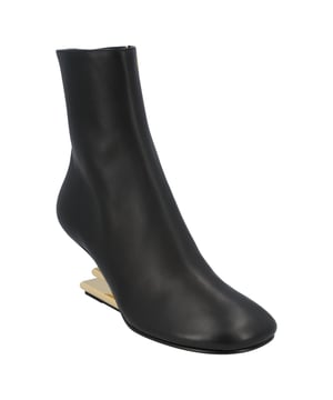 100% Calf Leather 
Made in Italy 
High diagonal F-shaped heel in gold-colored metal.
Heel height: 9.5 cm.
Rounded toe.Measurments:  height: 95 mm