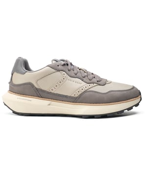 Zapatillas Cole Haan GrandPro Ashland para hombre en color gris, fabricadas en piel y suela de goma. Presentan: suela flowerfoam, marca Cole Haan y goma con diseño de diente de león.