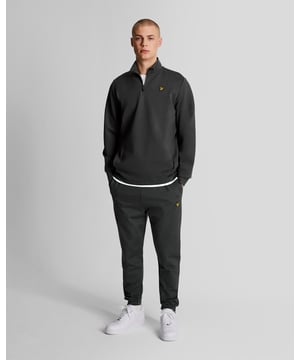 Drawcord waist.2-side pockets.Side seam zip cuffs.Regular fit.