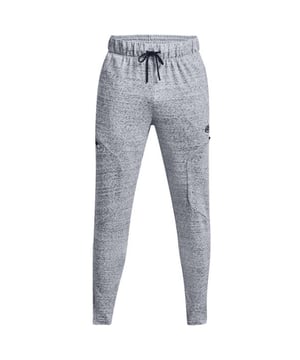 The Under Armour Curry Men's Grey Track Pants are a testament to style, comfort, and performance, designed to cater to the needs of athletes and individuals who appreciate both fashion and function. These track pants offer the perfect blend of modern aesthetics and athletic functionality.

Key Features:

 High-Quality Fabric:  Crafted from a premium blend of materials, these track pants feature a combination of polyester and elastane, ensuring durability and a comfortable fit that moves with you.

 Moisture-Wicking Technology:  Under Armour's Moisture Transport System is integrated into the fabric, effectively wicking away sweat and moisture from your body, keeping you dry and comfortable during workouts or everyday activities.

 Flexible and Breathable:  The fabric is designed to provide excellent breathability and flexibility, allowing for natural movement and airflow, which is crucial for both workouts and casual wear.

 Elastic Waistband:  The elastic waistband with an adjustable drawstring ensures a secure and customizable fit, allowing you to find your perfect comfort level.

 Tapered Fit:  These track pants feature a tapered leg design that offers a contemporary and athletic silhouette while providing ease of movement and a comfortable, snug fit.

 Side Pockets:  Two convenient side pockets provide storage for your essentials, such as keys, wallet, or your phone, making these pants versatile for both workouts and everyday wear.

 Curry Signature Branding:  These track pants are part of the Curry collection, featuring the distinctive logo of NBA superstar Stephen Curry. This branding adds a touch of style and authenticity to the design.