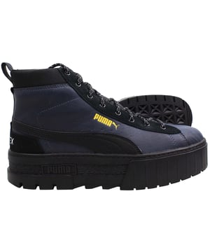 The Puma Mayze Mid GTX Women's Black Boots are a stylish and functional choice for women who need both fashion and performance in their footwear. These mid-cut boots feature a sleek black design with a rugged aesthetic, making them perfect for urban environments and outdoor adventures. The inclusion of GORE-TEX® (GTX) technology ensures that these boots are waterproof and breathable, providing all-weather protection and comfort. Whether you're navigating city streets or exploring the outdoors, the Puma Mayze Mid GTX boots offer a blend of durability, style, and practicality.
 
Key Features:
GORE-TEX® Waterproof Technology:

Ensures your feet stay dry and comfortable in wet conditions, while also allowing breathability to prevent overheating.


Mid-Cut Design:

Offers additional ankle support and a trendy, versatile look that pairs well with various outfits, from casual to sporty.


Premium Leather Upper:

The high-quality leather construction provides durability and a sleek, polished appearance that elevates the overall style of the boots.


Chunky Rubber Sole:

Features a bold, chunky design that not only adds to the boot's aesthetic but also provides excellent traction and stability on different surfaces.


Cushioned Midsole:

Delivers superior comfort and shock absorption, making these boots ideal for all-day wear, whether you're walking around the city or tackling rough terrain.


Metal Eyelets and Durable Laces:

Enhance the boot's rugged look and ensure a secure, adjustable fit that can withstand the demands of regular use.


Breathable Lining:

Works in conjunction with the GORE-TEX® membrane to keep your feet comfortable and well-ventilated, even during extended wear.


Sleek Black Colorway:

The all-black design is versatile and stylish, making these boots easy to pair with various outfits, from jeans to outdoor gear.


 
The Puma Mayze Mid GTX Women's Black Boots are an excellent choice for those who need a reliable, stylish, and functional boot for both urban and outdoor settings. With their waterproof protection, comfortable fit, and trendy design, these boots are perfect for women who want to look good while staying prepared for any weather.