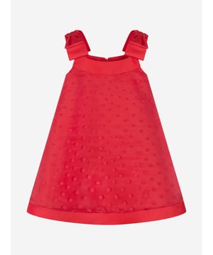 Mama Luma's sophisticated portfolio takes inspiration from a bygone era. This girls red pinafore dress is reflective of the Californian label's impeccable craftsmanship and precision of beauty. Crafted in a polka-dot chiffon pattern with red bow shoulder straps and delicate cotton lining. She will embody unparalleled confidence. Zip Fastening  70% Viscose  30% Polyester