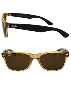 Ray-Ban Sunglasses New Wayfarer 2132 945/57 Honey Crystal Brown Polarized 55mm are an updated and slightly smaller interpretation of the Original Wayfarer. They feature a softer eye shape and sculpted temples that display the iconic Ray-Ban logo. The New Wayfarer 2132 are a versatile and playful choice that are available in countless colourways and the lightweight acetate frame is comfortable and easy to wear. The softer style of the 2132 suit more face shapes and is perfect for somebody that loves the Original Wayfarer design but is looking for a less dramatic look.