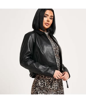 Barneys Originals real leather cropped Harrington. Side buckle tabs for added style. A versatile piece that pairs effortlessly with any outfit.