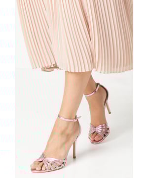 Whether attending a wedding or a dinner on vacation, these stunning heeled sandals are a versatile option for those looking for something sumptuous, yet, subtle. Their classic construction features a feminine peep toe, dainty ankle strap and gorgeous strappy front part. This timeless shoe will serve your wardrobe for years to come.
