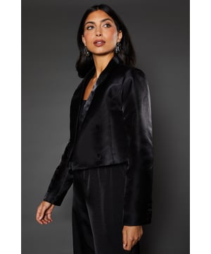 Chic double-breasted design for a sophisticated look
        Cropped length adds a modern twist to classic tailoring
        Sleek lapels and structured shoulders create a polished silhouette
        Long sleeves with button detailing for a refined finish
        Versatile piece that can be dressed up or down for various occasions
    
    This Wallis Crop Double Breasted Blazer is the epitome of contemporary elegance. Perfect for the woman who appreciates sophistication with a modern edge, this blazer effortlessly combines timeless style with current trends. The cropped length adds a fresh dimension to your outfit, making it ideal for pairing with high-waisted trousers or skirts. For a festive celebration or Christmas party, style it with wide-leg trousers and statement earrings to create a glamorous ensemble that will turn heads. The structured silhouette flatters your figure while providing comfort, ensuring you feel confident and poised throughout any event. Whether you're attending a formal occasion or looking to elevate your everyday wear, this blazer is a versatile piece that will become a staple in your wardrobe. Its ability to transition from day to night makes it an essential item for the fashion-forward woman who values both style and practicality.