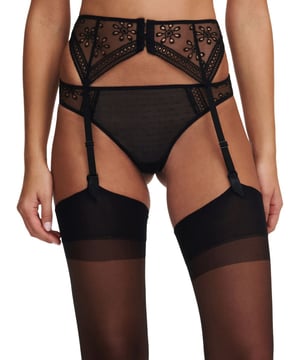 Passionata Prisca Suspender Belt. Featuring openwork floral embroidery, this garter features non removable straps and has a hook and eye closure. Product is recommended gentle wash only.