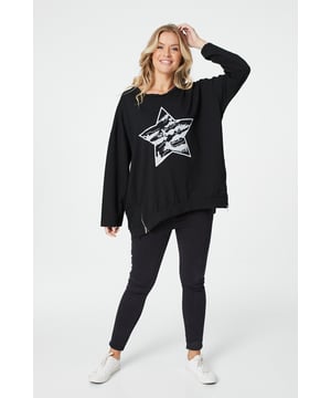 Add a star print oversized jumper to your closet. With a round neck, long sleeves and a hip length fit. Pair with skinny jeans trainers for a dressed down daytime look.